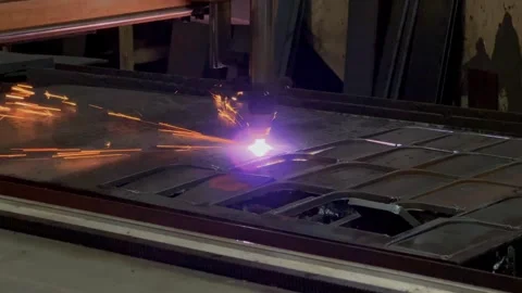 Working automatic plasma laser machine cutting the pattern of iron plate. Stock Footage 269318238
