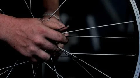 Working on a bicycle wheel close up Stock Photos