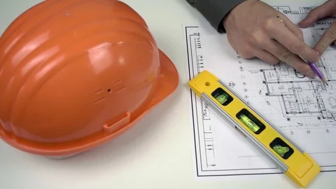 Working with Blueprints of House and Tablet Stock Footage 73832494