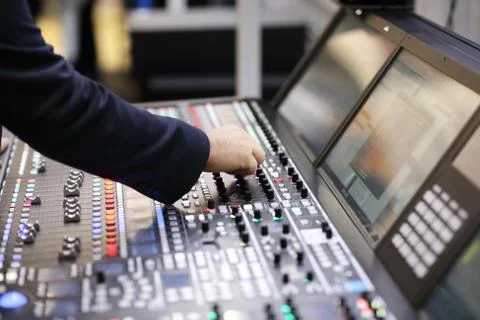 Working with broadcast audio mixing console Stock Photos