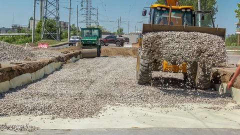 Working bulldozer on the construction of a road timelapse Stock Photos