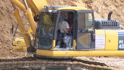 Working in the cab of the excavator Stock Footage 71340617