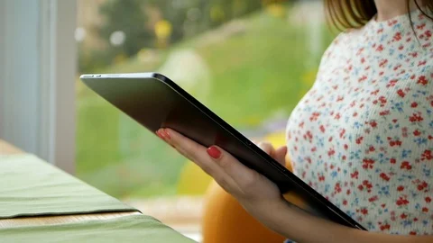 Working at the cafe. Close up of hands of young long hair woman sitting at the Video stock 100036188