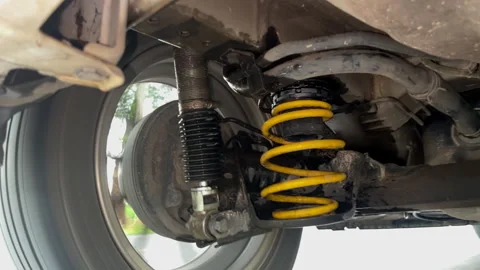 Working of car suspension.The spring and shock work together. Stock Footage 316982291