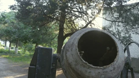 Working cement mixer. Mixes the sand, cement and water Stock Footage 79080139