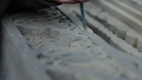 Working a chisel with a Armenian kakchkar. Cross stone Video stock 142385169