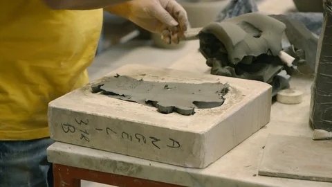 Working the clay in a mold Stock Footage 87031635