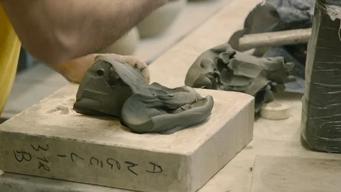 Working the clay in a mold Stock Footage 87031664