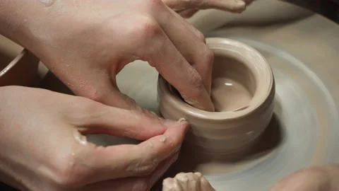 Working with clay on a potter's wheel Video stock 165547856