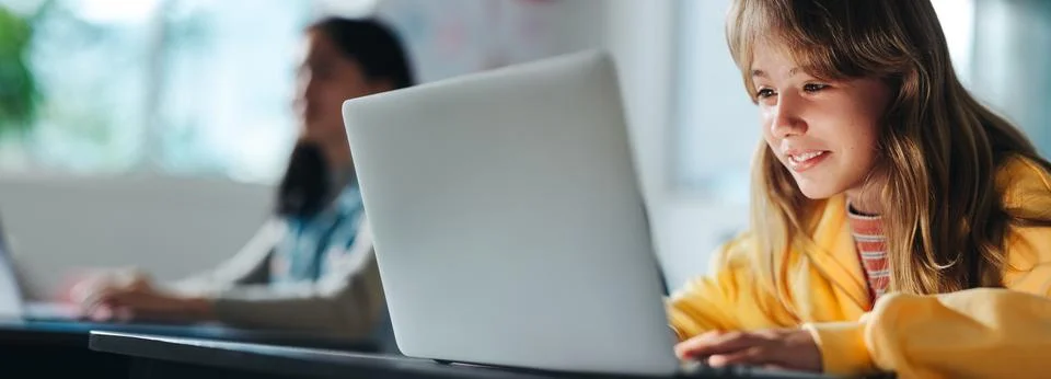 Working on a code, young kid learning programming with a laptop Foto stock