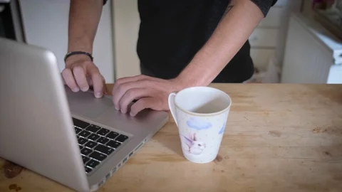 Working With A Computer And Drinking Coffee Stock Footage 119217685