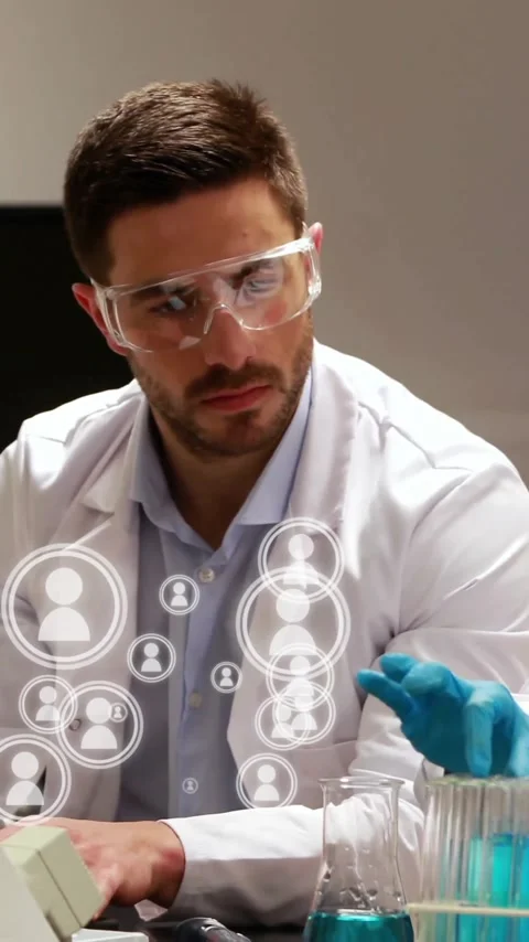 Working with computer and test tubes, scientists in lab coats analyzing data Stock Footage 319976154