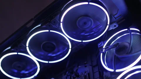 Working of computer cooling fan, the blue light. Fans Are Spinning Inside Stock Footage 235303925