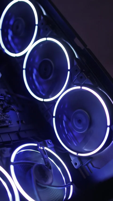 Working of computer cooling fan, the blue light. Fans Are Spinning Inside Stock Footage 274879848
