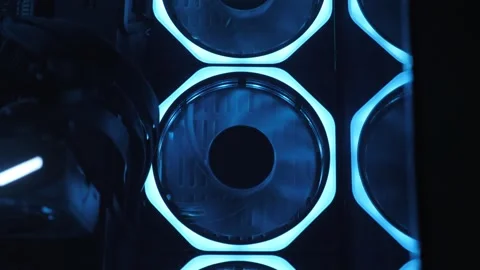Working of computer cooling fan, the blue light. Gaming pc glowing in the dark. Stock Footage 330869630