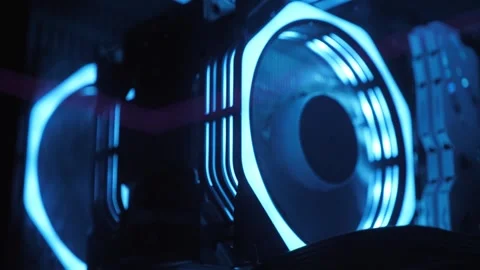 Working of computer cooling fan, the blue light. Gaming pc glowing in the dark. Stock Footage 332411186