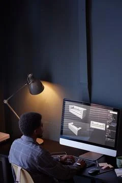 Working on Computer with Design Software in Office Setting Foto stock