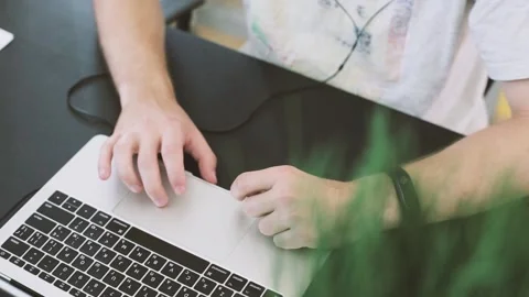 Working at the computer, hands typing on the keyboard at the desk in the office. Video stock 222624723