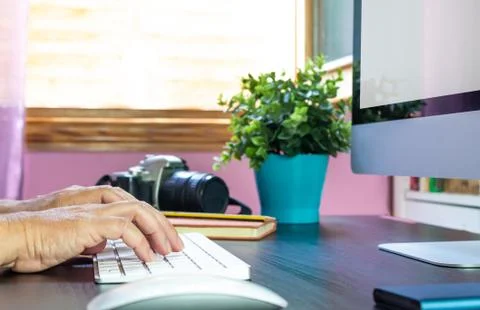 Working on computer at her home office Stock Photos