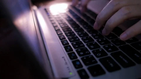 Working on Computer Laptop at Night in Office. Cropped Image of Woman's Hand 库存影片 114306992