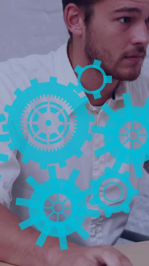 Working on computer, man with blue gears animation surrounding him Stock Footage 341956923