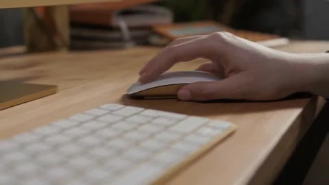 Working with a computer mouse and keyboard on a desk in the office Stock Footage 223122897