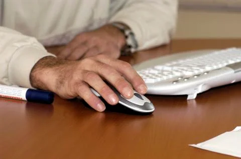 Working with a computer mouse 스톡 사진