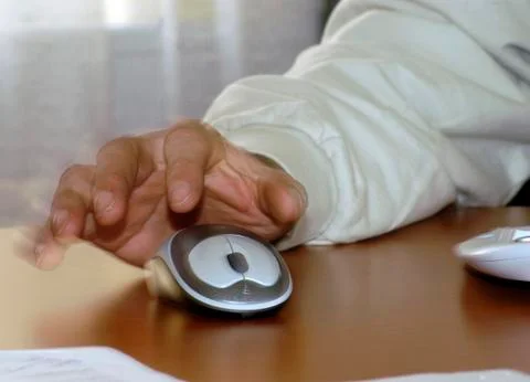 Working with a computer mouse 스톡 사진