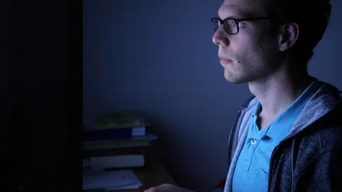 Working on computer by night at home, deadline for freelancer Stock Footage 98093622