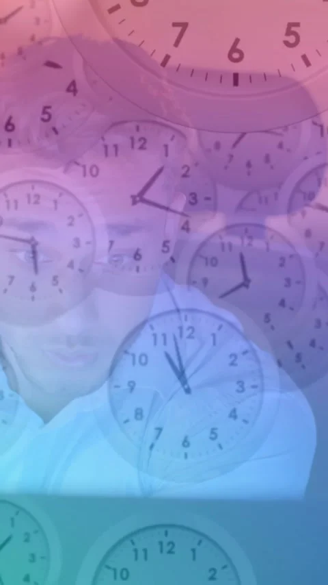 Working on computer in office, man with clocks animation in background Stock Footage 323780880