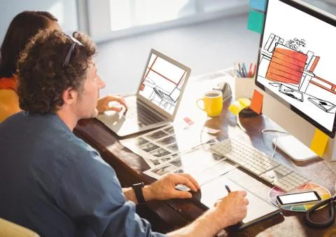 Working on the computer. ( on the screen new office designs (white and lack with Foto stock