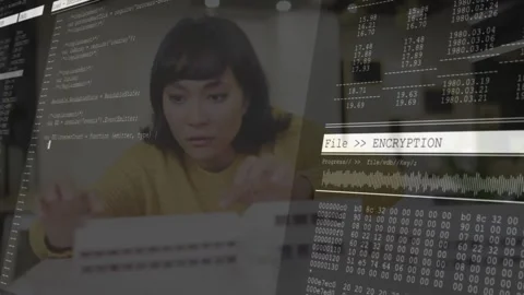 Working on computer, woman viewing encryption data and animation coding overlay Stock Footage 327714930