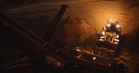 Working construction building site heavy machines trucks at night. BMPCC 4K Stock Footage 125847844