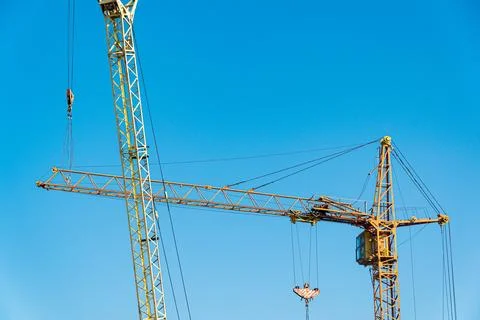 Working construction crane. Two construction cranes 库存照片