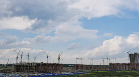 Working construction cranes ,summer day, sky with clouds, timelapse Stock Footage 64836532