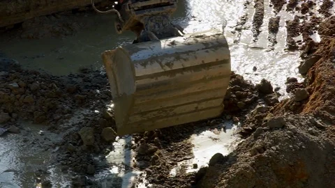 Working at a construction site, a excavator moving soil Stock Footage 88649803
