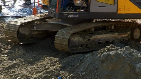 Working at a construction site, a excavator moving soil Stock Footage 88665282