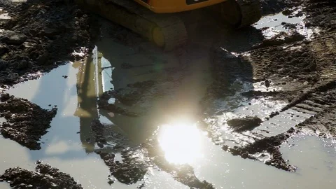 Working at a construction site, the reflection of a building excavator at work Stock Footage 88668929