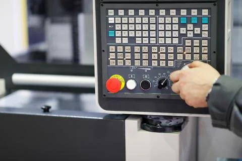 Working with control panel of CNC machining center Stock Photos