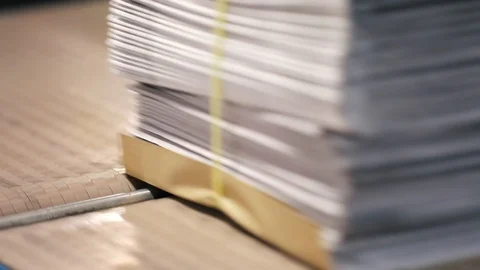 Working of conveyor belt with newspapers stacks on it. Stock Footage 112213832