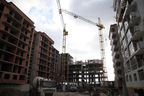 Working crane on the construction of the house. Stock Photos