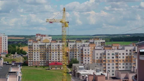 Working crane on construction set of building. Sunny Day. Field At Background Stock Footage 278665861