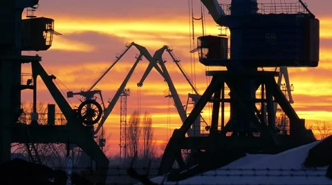 Working crane in the harbor at sunset. Stock Footage 59795290