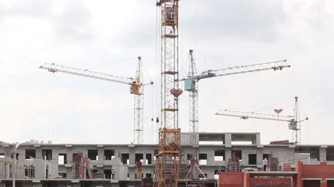 Working cranes and construction equipment at a large construction site Stock Footage 134416009