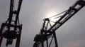 Working cranes and container ship in Hamburg harbour HD Footage