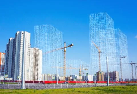 Working cranes and wire-frame structures Stock Photos