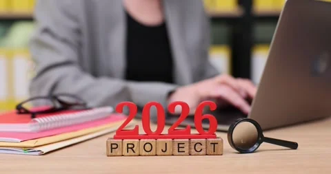 Working on a creative project for 2026 in a cozy office space filled with ideas Stock Footage 320634354