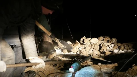 Working with a crowbar trying to break the iron cover Stock Footage 72995629