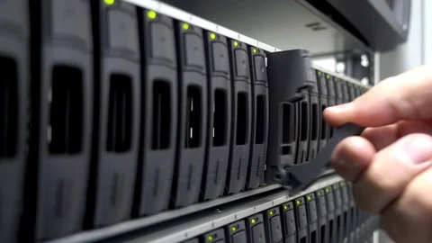 Working Data Center IT Engineer Installs Hard Drive into Server Rack. Stock Footage 102021673