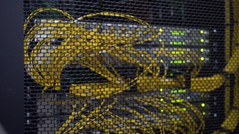 Working data servers with flashing LED lights. Blurred background. Yellow cable. Video stock 102830950